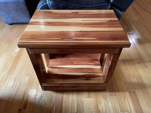 A wooden side table that James built.